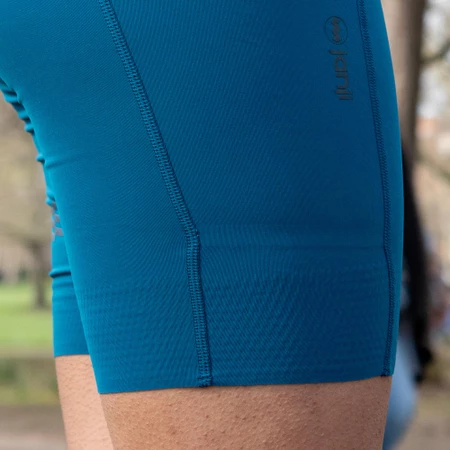 Janji Pace 7in Half Tights in Tidal